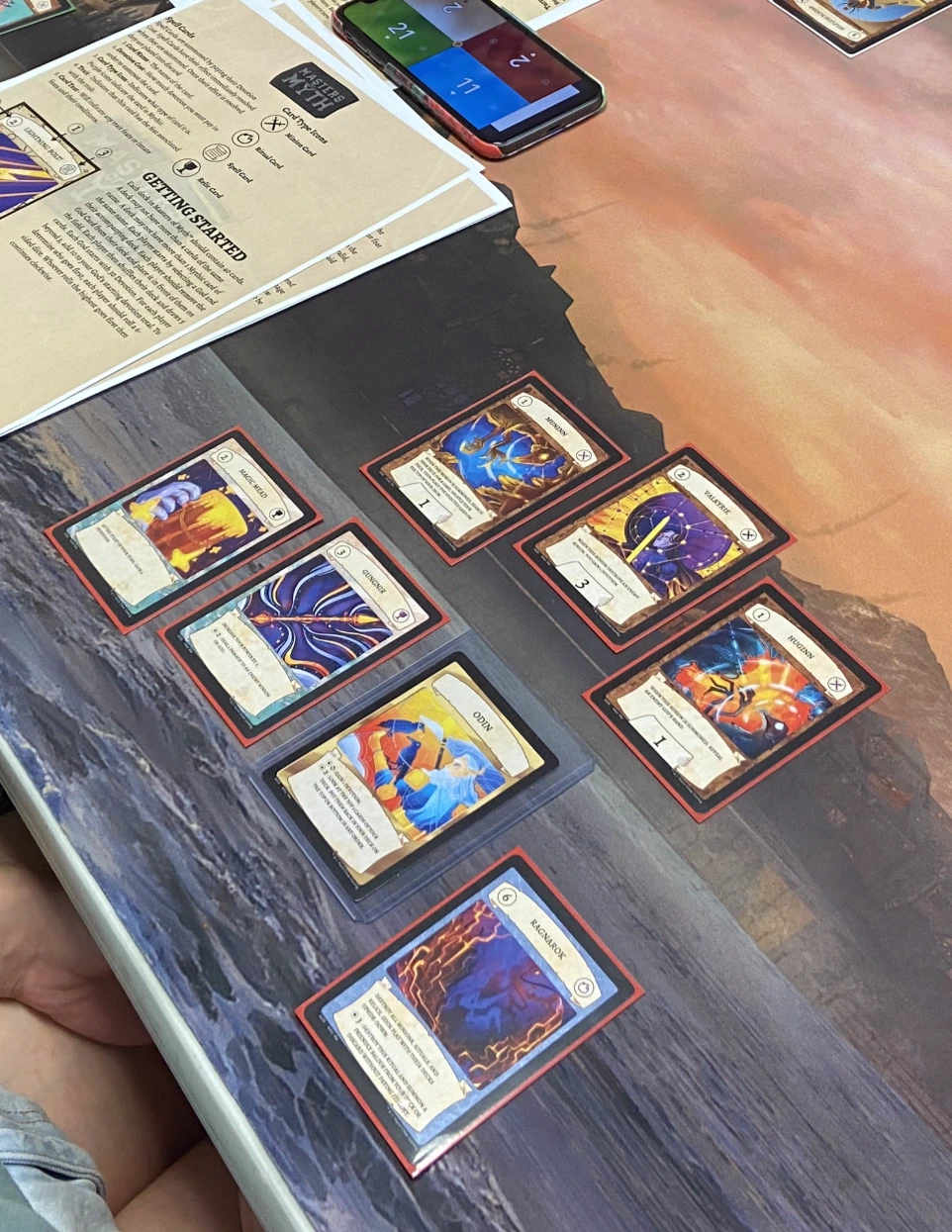 A player playing the Odin deck from Masters of Myth